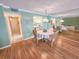Inviting dining room with a round table, four chairs, and seamless access to the kitchen at 6060 Shore S Dr # 906, Gulfport, FL 33707