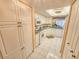 Efficient kitchen with white cabinetry, tiled floor and plenty of storage at 6060 Shore S Dr # 906, Gulfport, FL 33707