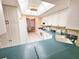 Bright kitchen featuring white cabinets, ample counter space, and easy access to the dining area at 6060 Shore S Dr # 906, Gulfport, FL 33707