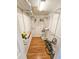 Well-organized walk-in closet with adjustable shelving and laminate wood floors, offering ample storage space at 6060 Shore S Dr # 906, Gulfport, FL 33707