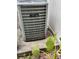 Exterior view of the Distinct by Amana branded AC unit next to a privacy fence and greenery at 608 Black Lion Ne Dr, St Petersburg, FL 33716