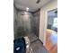 Contemporary bathroom with rain shower head, mosaic tile detail and modern sink at 608 Black Lion Ne Dr, St Petersburg, FL 33716