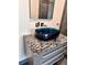 Stylish bathroom featuring a unique vessel sink and modern fixtures at 608 Black Lion Ne Dr, St Petersburg, FL 33716