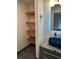 Chic bathroom with open wood shelving, vessel sink and modern faucet at 608 Black Lion Ne Dr, St Petersburg, FL 33716