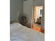 A bedroom with hardwood floors leading to an ensuite bathroom at 608 Black Lion Ne Dr, St Petersburg, FL 33716