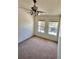 Well lit bedroom with neutral carpet and view from windows at 608 Black Lion Ne Dr, St Petersburg, FL 33716