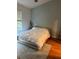 Bedroom featuring hardwood flooring and modern decor at 608 Black Lion Ne Dr, St Petersburg, FL 33716