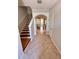 Welcoming foyer featuring tile flooring, staircase, and arched entryway at 608 Black Lion Ne Dr, St Petersburg, FL 33716