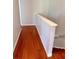 Upstairs hallway with hardwood flooring and a view of the staircase at 608 Black Lion Ne Dr, St Petersburg, FL 33716