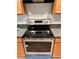 Stainless steel electric stove with glass top and silver knobs at 608 Black Lion Ne Dr, St Petersburg, FL 33716