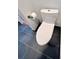 TOTO toilet in a modern bathroom with black tile flooring at 608 Black Lion Ne Dr, St Petersburg, FL 33716