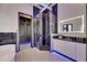 A well lit bathroom features a glass shower, soaking tub, and dual vanity at 6534 Simone Shores Cir, Apollo Beach, FL 33572