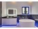 Modern bathroom with a soaking tub, sleek vanity, and illuminated mirror at 6534 Simone Shores Cir, Apollo Beach, FL 33572