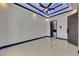 An empty room with tile flooring and custom lighting at 6534 Simone Shores Cir, Apollo Beach, FL 33572