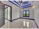 The bedroom features tile flooring, custom lighting, and a sliding glass door at 6534 Simone Shores Cir, Apollo Beach, FL 33572