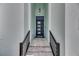 Stylish front entrance with a modern door, sleek railings, and tiled steps at 6534 Simone Shores Cir, Apollo Beach, FL 33572