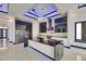 Modern kitchen boasts an island, stainless appliances, and recessed lighting with dark cabinets at 6534 Simone Shores Cir, Apollo Beach, FL 33572