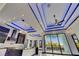 Modern kitchen boasts an island, stainless appliances, and recessed lighting with a large sliding glass door to the outside at 6534 Simone Shores Cir, Apollo Beach, FL 33572