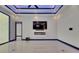 Bright living room showcasing tile floors, accent lighting, a television, and a modern fireplace at 6534 Simone Shores Cir, Apollo Beach, FL 33572