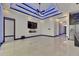 Spacious living room showcasing tile floors, accent lighting, television, and fireplace at 6534 Simone Shores Cir, Apollo Beach, FL 33572
