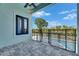 Covered patio overlooking the pool and yard, ideal for outdoor living at 6534 Simone Shores Cir, Apollo Beach, FL 33572