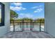 View of the pool from the covered patio featuring pavers and a safety fence at 6534 Simone Shores Cir, Apollo Beach, FL 33572