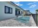 Inviting outdoor pool area with a spa and a serene backyard view at 6534 Simone Shores Cir, Apollo Beach, FL 33572
