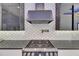 The modern kitchen has a stainless steal range with a tile backsplash at 6534 Simone Shores Cir, Apollo Beach, FL 33572