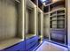 Spacious walk-in closet featuring custom shelving with integrated lighting at 6534 Simone Shores Cir, Apollo Beach, FL 33572