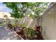 Landscaped backyard featuring gravel, flowerbeds, and a privacy fence for outdoor enjoyment at 700 Starkey Rd # 1216, Largo, FL 33771