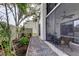 Scenic backyard view from screened porch highlighting plants, privacy fence, and outdoor tranquility at 700 Starkey Rd # 1216, Largo, FL 33771