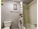 Cozy bathroom featuring a shower-tub combo with decorative curtain for added privacy and style at 700 Starkey Rd # 1216, Largo, FL 33771