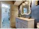 Modern bathroom features a stylish vanity, mirror, and updated fixtures at 700 Starkey Rd # 1216, Largo, FL 33771