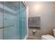 This renovated bathroom features modern glass shower with upgraded fixtures and sleek design at 700 Starkey Rd # 1216, Largo, FL 33771