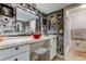 Striking bathroom features unique wall design, granite countertops, and modern bowl sink at 700 Starkey Rd # 1216, Largo, FL 33771