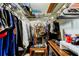 Walk-in closet with ample storage featuring an organized hanging system and shelving at 700 Starkey Rd # 1216, Largo, FL 33771