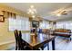 Elegant dining room features modern chandelier lighting and an open layout at 700 Starkey Rd # 1216, Largo, FL 33771