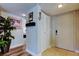 Bright foyer features tile flooring, a closet, and a view into the living area at 700 Starkey Rd # 1216, Largo, FL 33771