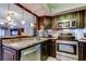 The kitchen sink has updated counters, cabinets, and stainless steel appliances at 700 Starkey Rd # 1216, Largo, FL 33771