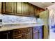 The kitchen counters feature dark cabinets, updated countertops, and stainless steel appliances at 700 Starkey Rd # 1216, Largo, FL 33771
