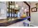 A kitchen bar features pendant lighting, seating, and is accessible to the kitchen area at 700 Starkey Rd # 1216, Largo, FL 33771