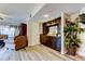 Open-concept living area with a built-in bar and comfortable seating at 700 Starkey Rd # 1216, Largo, FL 33771
