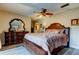 Spacious bedroom features a ceiling fan, wood-look floors and elegant dresser at 700 Starkey Rd # 1216, Largo, FL 33771