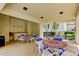 Community patio area with tables, chairs, and a serving area, perfect for outdoor gatherings at 700 Starkey Rd # 1216, Largo, FL 33771