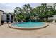 Inviting community pool surrounded by lush landscaping and comfortable lounge chairs at 700 Starkey Rd # 1216, Largo, FL 33771