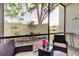 Inviting screened porch area with a view of the fenced backyard featuring lush landscaping at 700 Starkey Rd # 1216, Largo, FL 33771