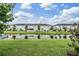 Scenic backyard overlooking a tranquil pond surrounded by well-maintained landscaping at 7030 Summer Holly Pl, Riverview, FL 33578