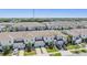 Wide aerial view of townhomes showcases neat landscaping, driveways, and a sense of community at 7030 Summer Holly Pl, Riverview, FL 33578