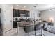 Modern kitchen featuring an island with seating and an open layout to living space at 7030 Summer Holly Pl, Riverview, FL 33578