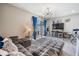 Open-concept living room with bright natural light and a sliding glass door to patio at 7030 Summer Holly Pl, Riverview, FL 33578